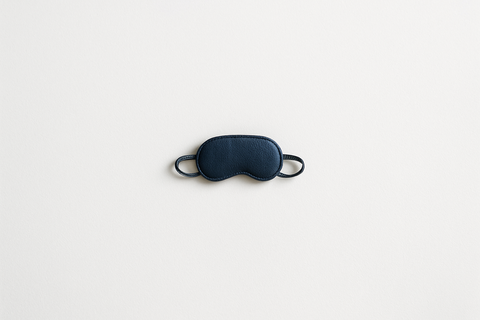 very small sleeping mask at the center of white background